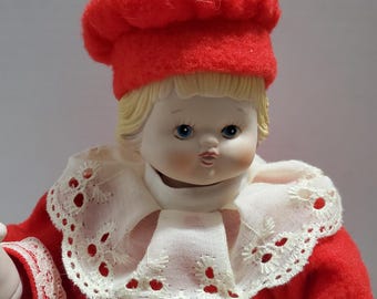 Porcelanowa lalka świąteczna nakręcana, antyczna zabawka w kształcie pozytywki
