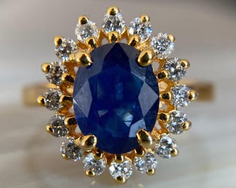 Halo-ring blauwe saffier, ovale 18 kt gouden diamant, vintage verlovingsring
