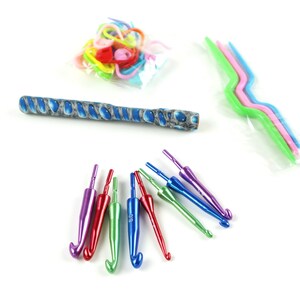 May include: A set of colourful crochet hooks, including a long, blue and grey crochet hook, a set of three multi-coloured crochet hooks, and a bag of colourful stitch markers.