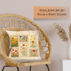 May include: A decorative pillow with a floral stamp design featuring sunflowers, poppies, and other flowers. The pillow is on a wicker chair. The text above the pillow reads "FLORAL STAMP ART SET PILLOW & PRINTS INCLUDED."