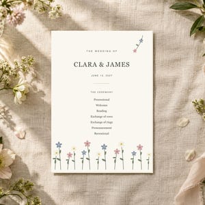 Puede incluir: Una tarjeta de programa de boda rectangular con fondo crema, que presenta el texto THE WEDDING OF CLARA & JAMES, JUNE 14, 2027, y THE CEREMONY seguido de una lista de eventos. El diseño incluye pequeñas ilustraciones florales coloridas.