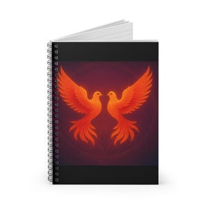 May include: Spiral-bound notebook featuring a vibrant illustration of two orange phoenixes facing each other against a dark red background. The birds have outstretched wings and detailed feathering. The notebook has a black border and white lined pages.