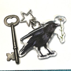 Adorable 3" Acrylic Key Chain or Charm - Crow with a Daisy - Silver Star Charm - Backpack Charm or Key Ring - Crow or Corvid Bird Lover Gift
