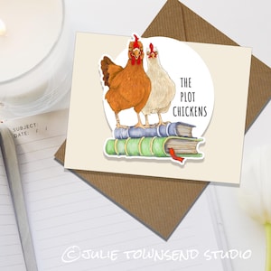 May include: A greeting card with a sticker of two chickens standing on a stack of books. The sticker says "The Plot Chickens".