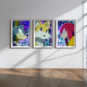 May include: Three framed art prints featuring characters from the Sonic the Hedgehog franchise. Each print showcases a different character: Sonic, Tails, and Knuckles, set against a vibrant, futuristic background with purple and blue hues.