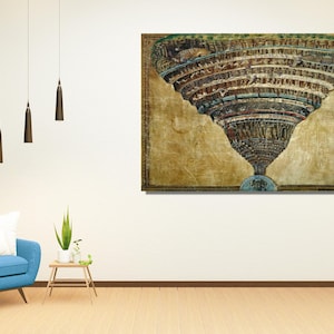May include: A framed artwork showing a detailed, layered illustration of a conical structure, possibly a depiction of hell. The artwork is in warm, earthy tones with a gold-coloured background. The image is displayed on a white wall above a blue armchair.