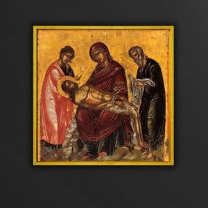 May include: A religious icon depicting a scene with figures in robes. The central figure is held by a woman in a red robe. Two other figures stand on either side. The background is gold, and the icon is framed in gold.