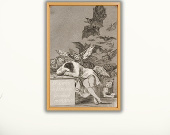 May include: A framed print of Francisco Goya's "The Sleep of Reason Produces Monsters." The artwork shows a figure slumped over a table, surrounded by bats and owls. Text in Spanish is visible on the table. The print is in a wooden frame.