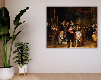 May include: A framed print of Rembrandt's "The Night Watch" hangs on a white wall. The painting depicts a group of figures in historical attire, illuminated by a warm light source. The artwork features a dynamic composition with a variety of characters in action.