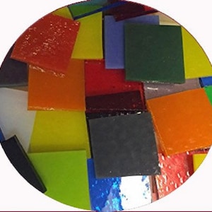 May include: Assortment of colorful glass tiles in various shapes and sizes. The tiles are arranged in a random pattern, creating a mosaic effect. The colors include red, orange, yellow, green, blue, purple, and black.