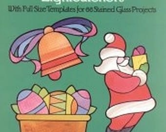 May include: A book cover with a green background and illustrations of a bell, a basket of eggs, and Santa Claus. The title of the book is "Easy to Make Christmas and Holiday Lightcatchers" with the subtitle "With Pull Size Templates for 66 Stained Glass Projects". The author's name is "Ed Sibbett, Jr."