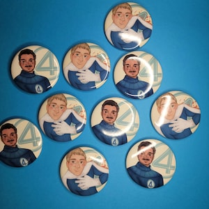 May include: A collection of round buttons featuring a cartoon illustration of a man in a blue and white superhero costume. The buttons have a cream-colored background with the number 4 and a red and orange design.