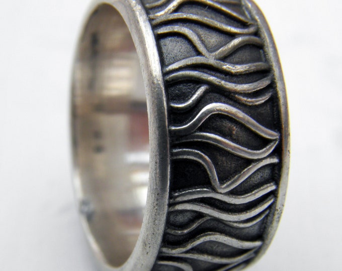 KFRWATER Water's Edge Ring in silver designed by Kim Fo