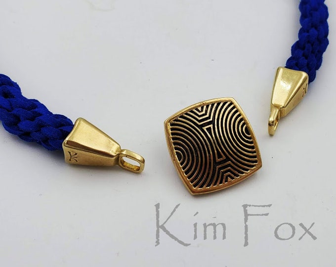 KF372 A Pair of Rounded Rectangle cones with loop designed white and golden bronze by Kim Fox perfect for cord, leather, kumihimo.