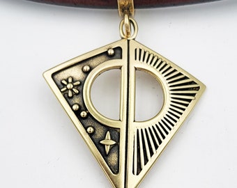 KFP491 The Sun, Moon Stars reversible pendant in golden bronze and sterling silver designed by Kim Fox