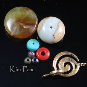 May include: A collection of colorful beads and a gold metal clasp. The beads include turquoise, red, and brown. The clasp is a spiral design.