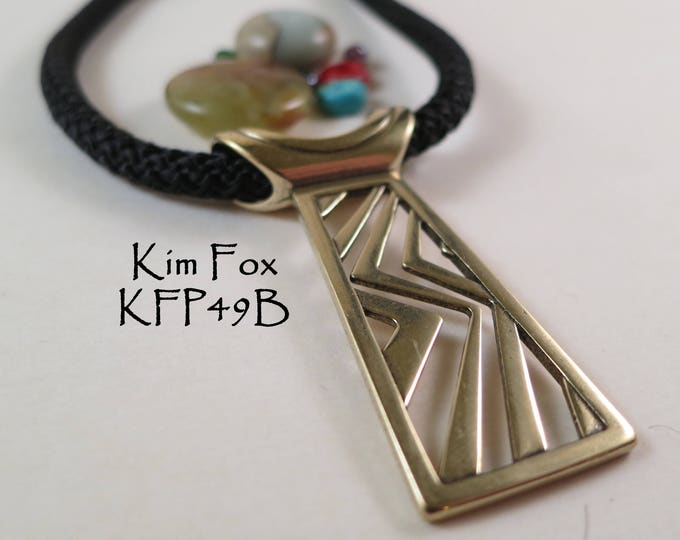 Higher Ground Tablet Pendant in Golden Bronze designed by Kim Fox
