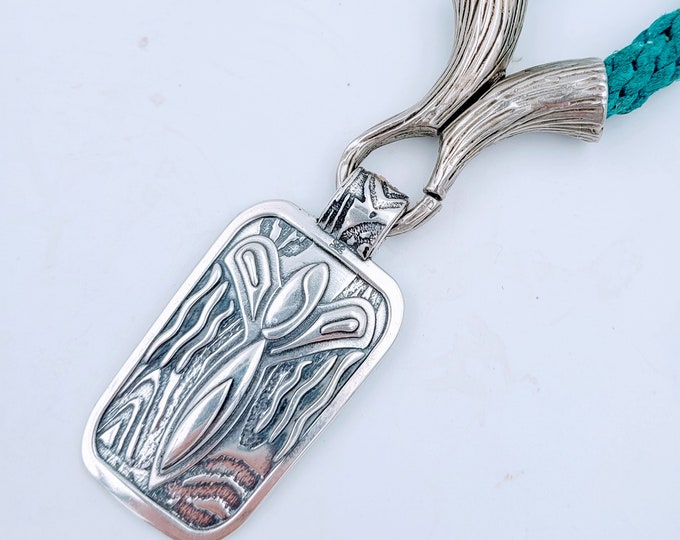 KFP457 Large Desert Angel Pendant designed by Kim Fox reminiscent of petroglyphs of the Southwestern USA.