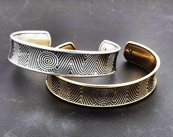 KFB505 Solar Pattern Adjustable Cuff in silver and bronze designed by Kim Fox