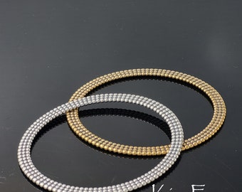 KFB29 7 inch Beaded Bangle in Sterling Silver Two sided oval shaped bangle with solid metal construction