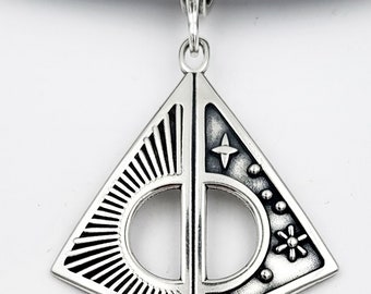 KFP491 The Sun, Moon Stars reversible pendant in golden bronze and sterling silver designed by Kim Fox