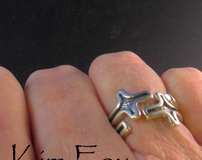 KFR225 Interlocked Stackable Pair of Cross Rings - adjustable - can be worn singly or in pair in silver designed by Kim Fox