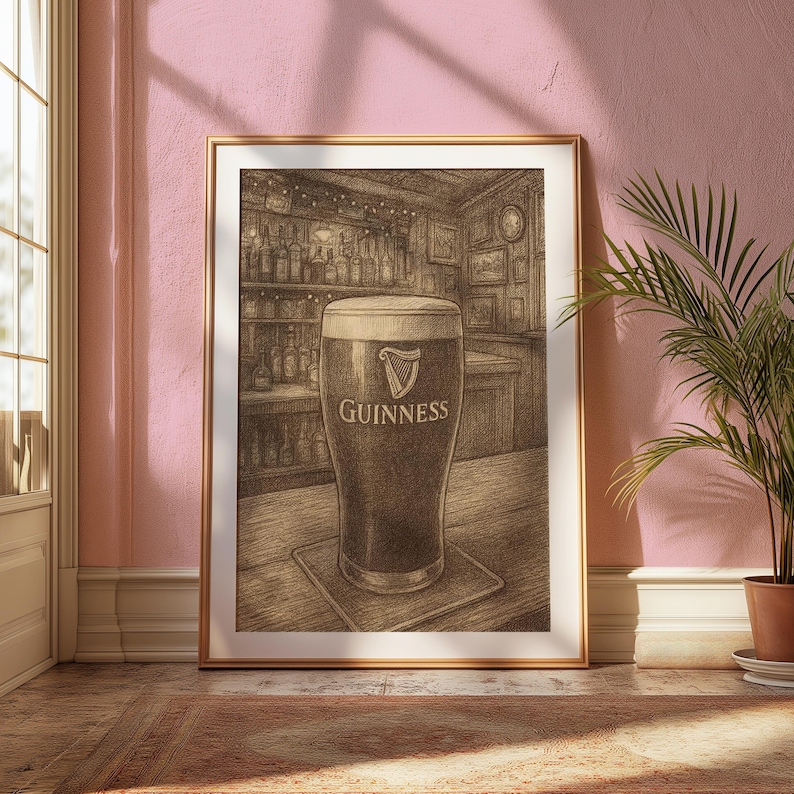 May include: Framed print of a pint of Guinness stout in a pub setting. The artwork features a full glass of dark beer with a creamy head, the Guinness logo, and a detailed background of a bar with bottles and decor.