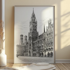 Pode incluir: Impressão arquitetônica em preto e branco de uma praça da cidade europeia, com um edifício alto e ornamentado com uma torre do relógio. A impressão é emoldurada em uma moldura de metal prateado. A imagem é uma ilustração detalhada da arquitetura da cidade.