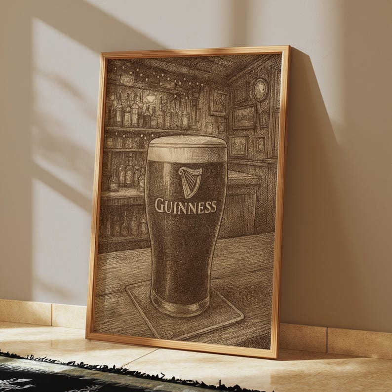 May include: A framed pencil sketch of a pint of Guinness stout in a pub setting. The glass is filled with dark beer and a creamy head, with the Guinness logo prominently displayed. The background shows a bar with bottles and decor.