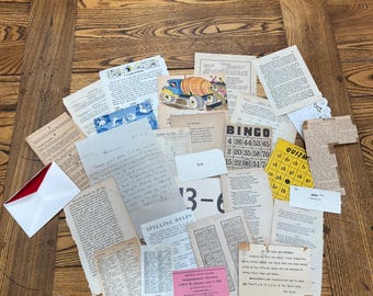 May include: A collection of vintage ephemera, including handwritten notes, printed pages, and a bingo card, arranged on a wooden surface. A small, colorful illustration of a truck with a tank is visible.