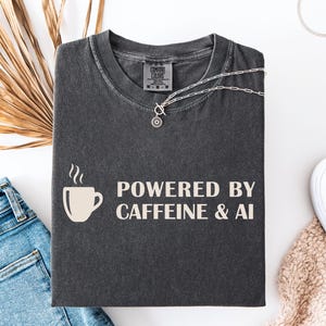 AI Engineer T-Shirt, Powered by Caffeine and AI, Programmer Gift, Computer Science Tee, Tech Humor, Coding Gift, Software Developer Apparel