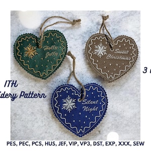 May include: Three heart-shaped Christmas ornaments with embroidered designs. One is green with "Holly Jolly", another is brown with "Sweet Christmas", and the third is blue with "Silent Night". Each has a snowflake and a decorative border. They are approximately 5x5 inches.