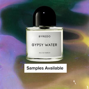 May include: A clear glass perfume bottle with a black cap. The label reads "BYREDO GYPSY WATER EAU DE PARFUM." The background is a colorful, abstract blend of purple, green, and yellow. Text at the bottom says "Samples Available."