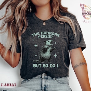 Horrors Persist But So Do I shirt, Raccoon shirt, Trendy Shirts, depression anxiety, Meme Shirt, oppossum tshirt, Funny Graphic Shirt, funny