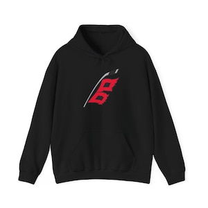 May include: Black hooded sweatshirt with a red and white graphic design on the front. The design features a stylized letter "B" with a red and white color scheme. The sweatshirt has a front pocket and a drawstring hood.