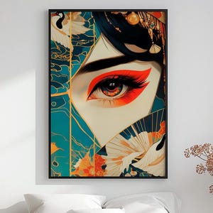 May include: A framed art print featuring a stylized eye with vibrant red and orange eyeshadow. The artwork includes a fan and crane imagery, set against a teal and gold background. The image has a black frame.