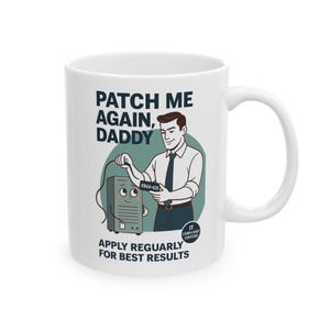 May include: White ceramic mug featuring a cartoon illustration. The design includes a man in a suit connecting a cable to a computer, with the text "PATCH ME AGAIN, DADDY" and "APPLY REGULARLY FOR BEST RESULTS".