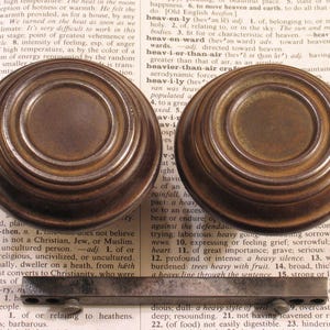 May include: A set of three ceramic mugs with a speckled, matte finish. The mugs are in shades of cream, light gray, and dark gray. Each mug has a simple, minimalist design, perfect for coffee or tea.