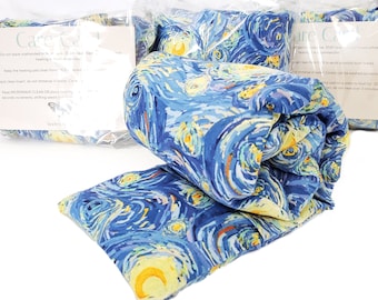 May include: A blue and yellow patterned heat pack with a white label that reads "Care-C-Cal" and includes instructions for use. The heat pack is rolled up and packaged in a clear plastic bag.