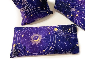 May include: Three celestial-themed pillows in varying sizes. The pillows feature a dark blue background with a gold celestial design, including stars, constellations, and a yin-yang symbol. The pillows are designed for comfort and relaxation.