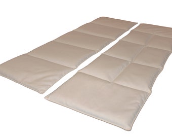 May include: Two beige quilted mattress toppers, each with six rectangular quilted sections. The toppers are laid out side by side, with the top edges aligned.
