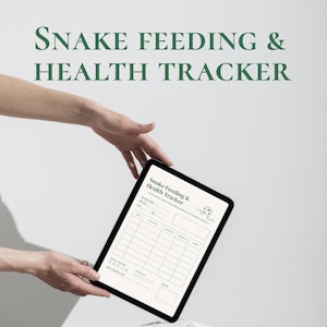 May include: A digital tablet displaying a "Snake Feeding & Health Tracker" with a green text overlay. The tracker features sections for recording feeding details, species, and health observations. The tablet is held against a white background.