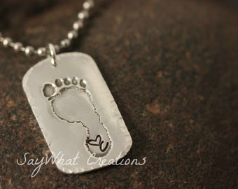 Your baby or child's ACTUAL footprints made into silver dog tag Includes ONE footprint charm with stamped initial and heart