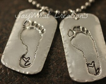 Your baby or child's ACTUAL footprints made into silver dog tags Includes TWO footprint charms with stamped initial and heart