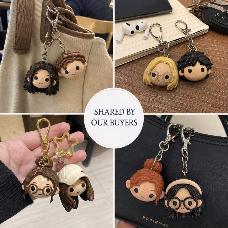 May include: A collection of character keychains featuring stylized heads with various hair colors, styles, and accessories like glasses or hats. Each keychain includes a metal chain and a lobster clasp, showcasing diverse facial expressions and designs.