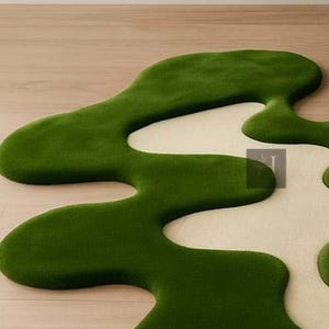 May include: A green and cream-colored rug with an organic, flowing design. The rug features a vibrant green, plush texture that contrasts with the cream-colored sections. The unique shape adds a modern touch to any room.