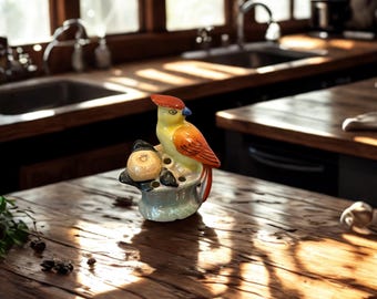 Rana para flores con forma de pájaro de Noritake Lusterware vintage – década de 1920. Figura de un loro sobre una cesta.