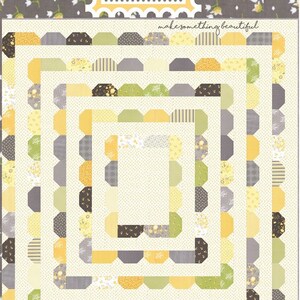 May include: A quilt with a repeating pattern of octagons and rectangles in shades of yellow, green, gray, and black. The quilt has the text "Coriander Quilts" and "#128 Garden District" on it.