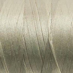 May include: Close-up of a spool of light green thread. The thread is tightly wound, with visible individual strands creating a textured surface. The color is a muted, neutral green, suitable for various sewing projects.