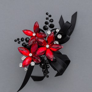 red and black wrist corsage for prom, homecoming, or weddings